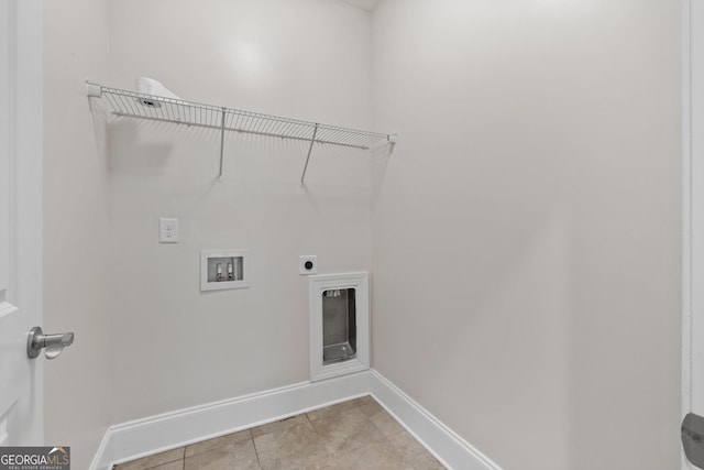 laundry room with light tile patterned floors, hookup for a washing machine, and electric dryer hookup