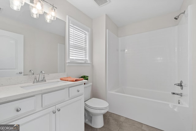 full bathroom featuring tile patterned floors, bathtub / shower combination, toilet, and vanity