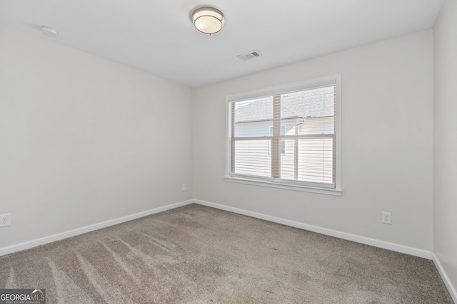 empty room featuring carpet flooring