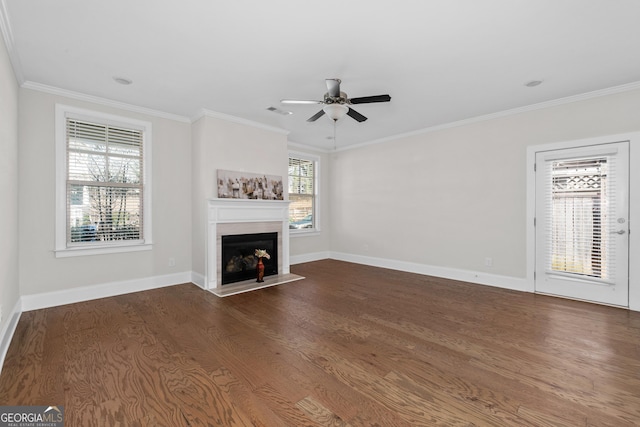 unfurnished living room with ceiling fan, dark hardwood / wood-style flooring, and ornamental molding