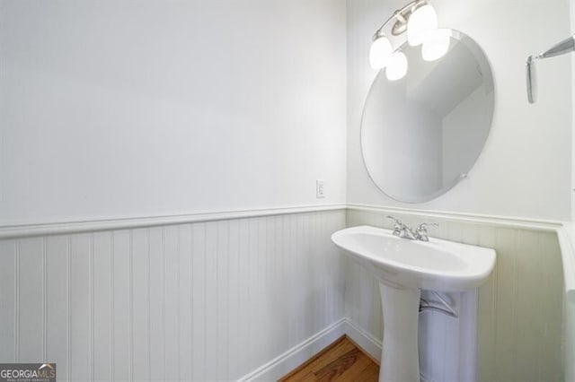 bathroom with sink and hardwood / wood-style flooring