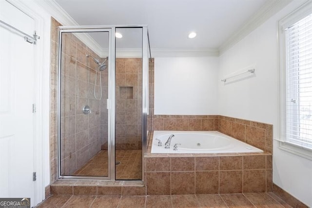 bathroom with crown molding and plus walk in shower