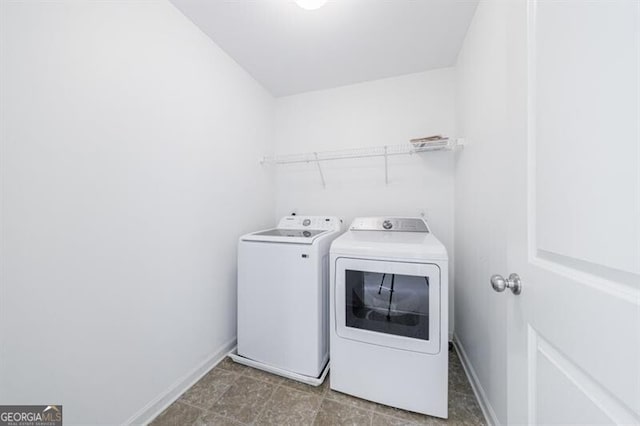 clothes washing area with independent washer and dryer