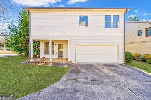 view of front of home with a garage and a front yard