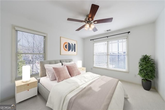 carpeted bedroom featuring ceiling fan