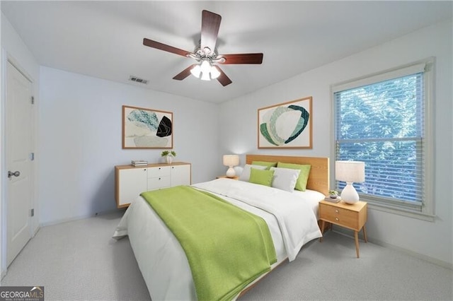 carpeted bedroom featuring ceiling fan