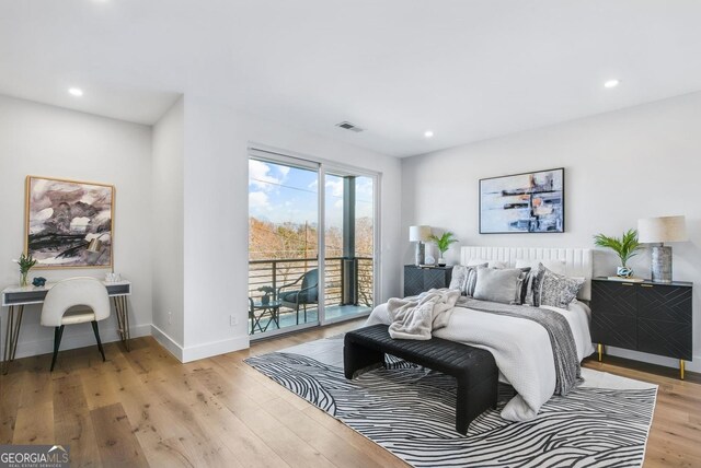 bedroom featuring access to exterior, recessed lighting, visible vents, wood finished floors, and baseboards