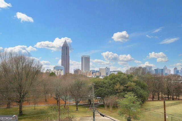 balcony with a ceiling fan and a city view