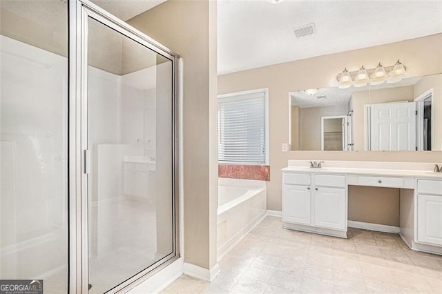 3055 Cooper Woods Ln, Loganville, GA 30052 - full bathroom featuring a shower stall, a bath, and double vanity