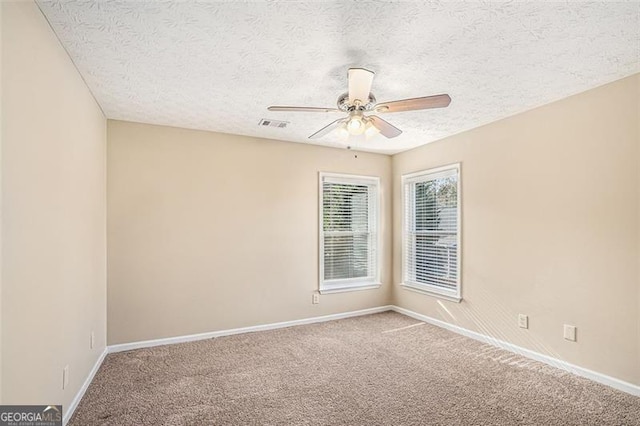 3055 Cooper Woods Ln, Loganville, GA 30052 - carpeted spare room with a ceiling fan and a textured ceiling