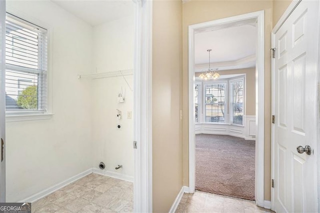 3055 Cooper Woods Ln, Loganville, GA 30052 - laundry area featuring a chandelier and light carpet