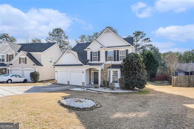 3055 Cooper Woods Ln, Loganville, GA 30052 - traditional-style house featuring concrete driveway, a garage, board and batten siding, and stone siding