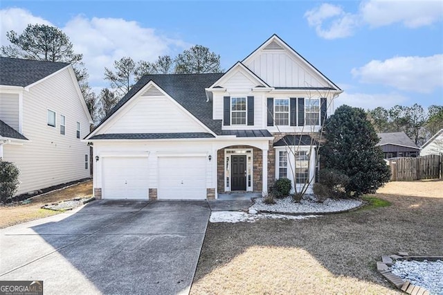 3055 Cooper Woods Ln, Loganville, GA 30052 - traditional-style home featuring board and batten siding, driveway, an attached garage, and stone siding