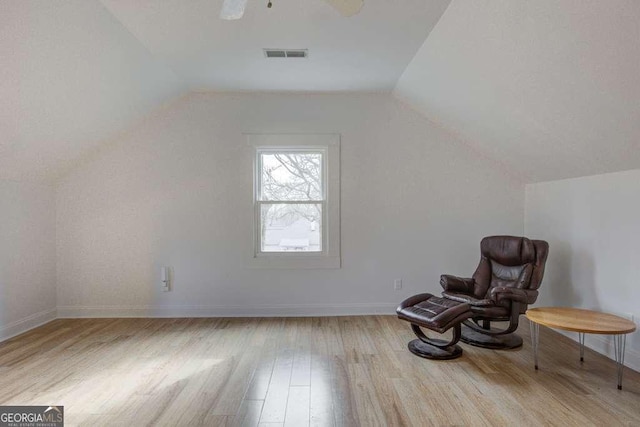 unfurnished room featuring ceiling fan, vaulted ceiling, and light hardwood / wood-style flooring