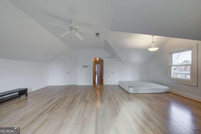 bonus room featuring ceiling fan, lofted ceiling, and light hardwood / wood-style flooring