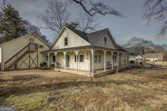 view of front of house with a front lawn and a patio