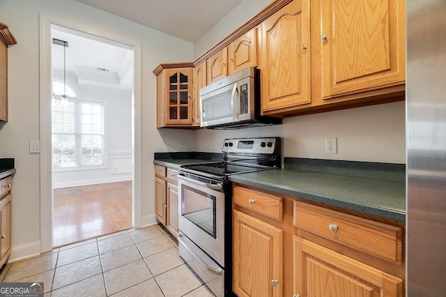 kitchen featuring light tile patterned floors and appliances with stainless steel finishes