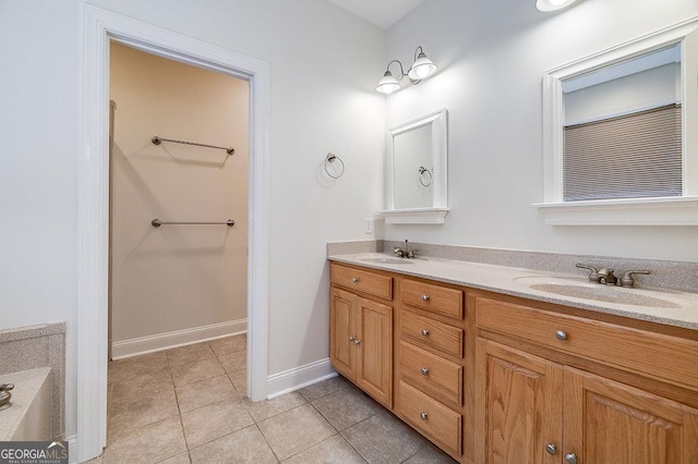 bathroom featuring tile patterned floors and vanity