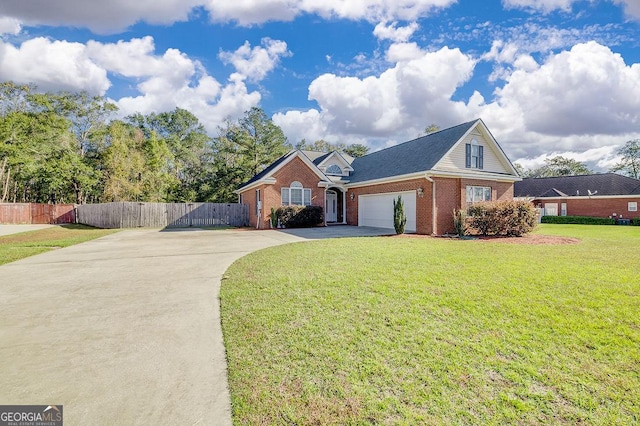 view of front of property with a front yard and a garage