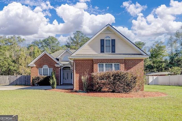 view of property featuring a front lawn