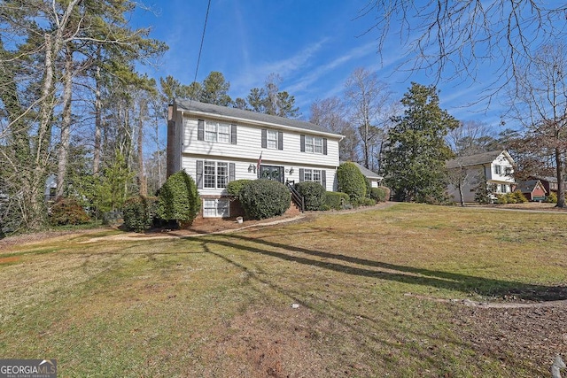 view of front of property with a front lawn