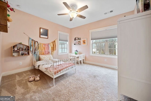 carpeted bedroom featuring ceiling fan