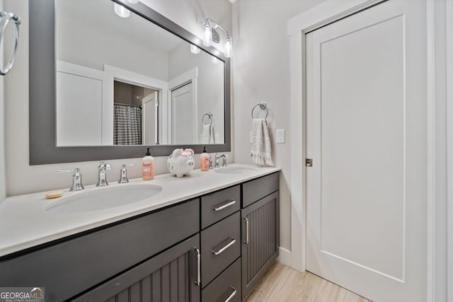 bathroom featuring vanity and hardwood / wood-style flooring