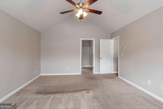 unfurnished bedroom with ceiling fan, high vaulted ceiling, and carpet floors