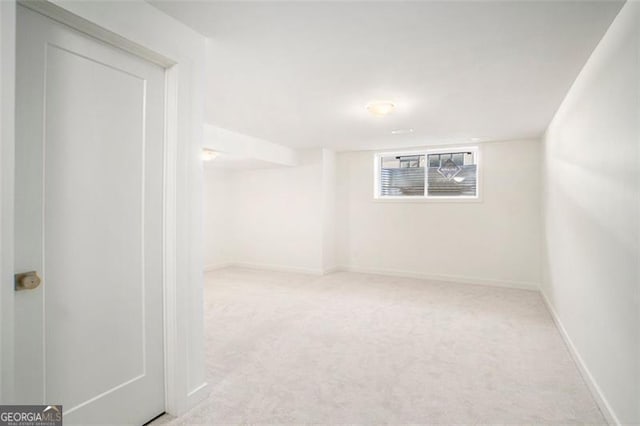 spare room with light carpet