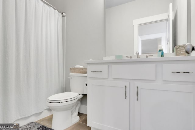 bathroom with vanity, a shower with curtain, tile patterned floors, and toilet