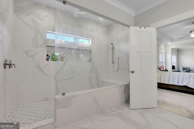 bathroom featuring ceiling fan, ornamental molding, and tiled shower