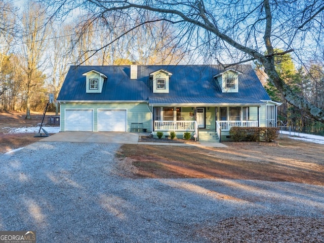 cape cod house featuring a garage and a porch