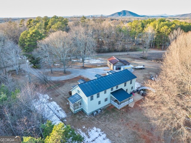 new england style home with a garage and a porch