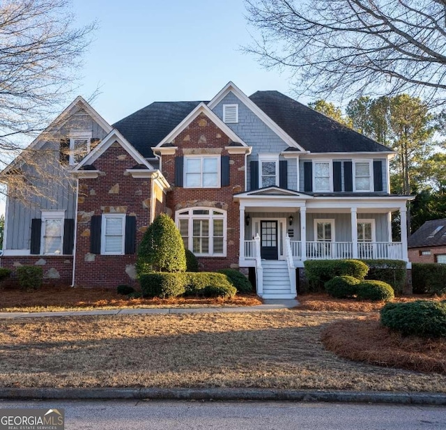 view of front of property featuring covered porch