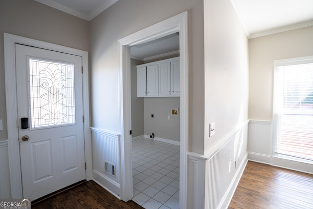 foyer featuring ornamental molding and dark hardwood / wood-style flooring