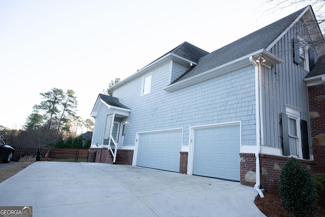 view of side of property featuring a garage