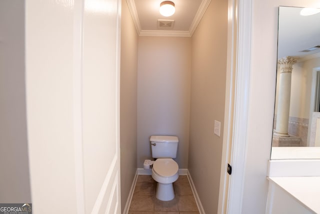 bathroom with toilet, tile patterned flooring, and crown molding