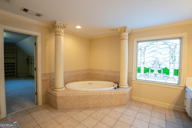 bathroom featuring tiled tub, tile patterned floors, vanity, and ornamental molding