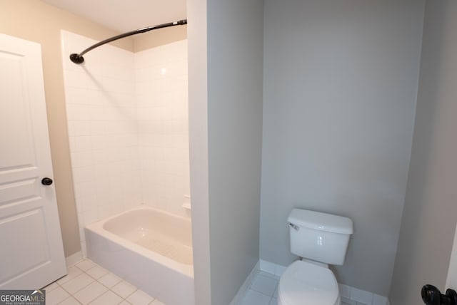 bathroom featuring toilet, tile patterned floors, and bathtub / shower combination