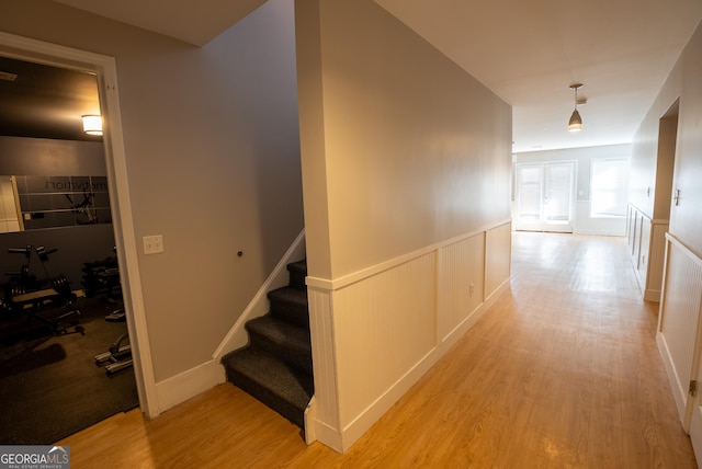 corridor with light hardwood / wood-style flooring