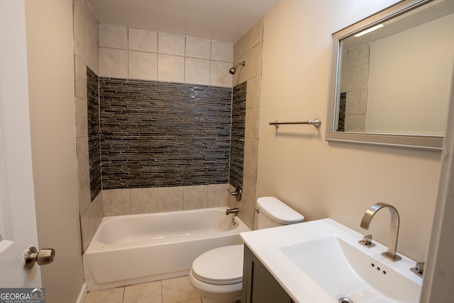 full bathroom featuring toilet, tiled shower / bath combo, vanity, and tile patterned floors