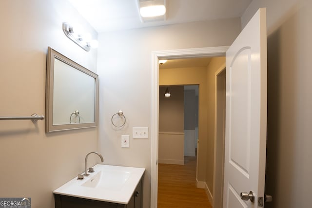 bathroom with vanity and hardwood / wood-style floors