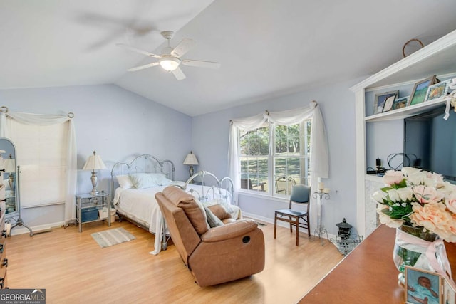 bedroom featuring light wood-type flooring, ceiling fan, and lofted ceiling