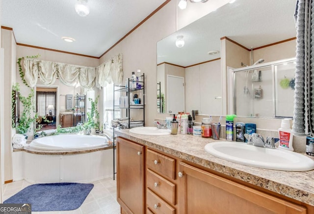 bathroom featuring a textured ceiling, vanity, crown molding, and plus walk in shower