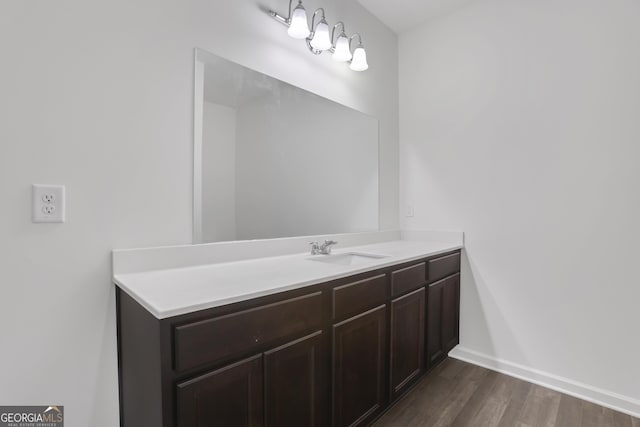 bathroom with vanity and wood-type flooring