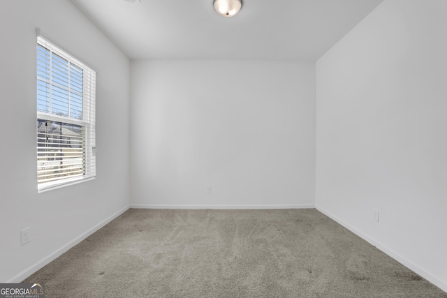 unfurnished room featuring carpet