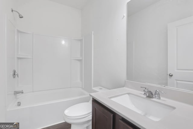 full bathroom featuring shower / tub combination, vanity, and toilet