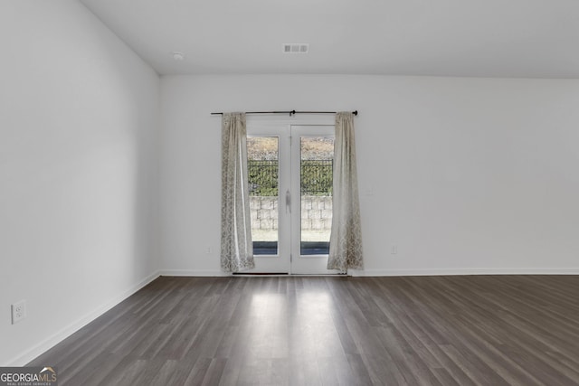 empty room with dark hardwood / wood-style floors