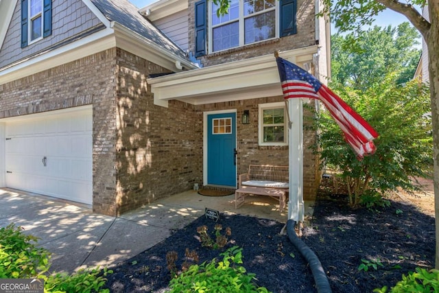 view of exterior entry featuring a garage