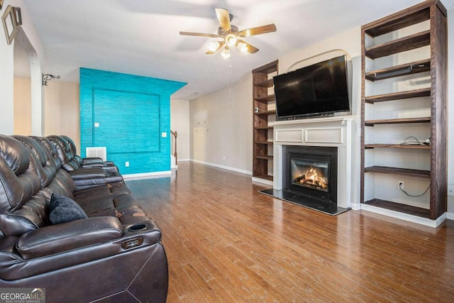 living room with ceiling fan and hardwood / wood-style floors